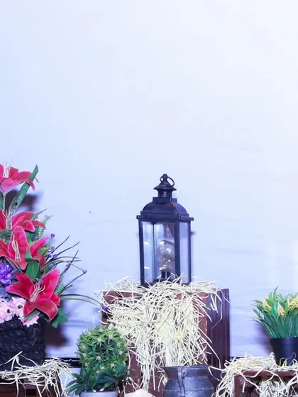 Another example of our rustic decor for food stations, featuring a mix of artificial flowers, a lantern, and hay-filled crates to create a charming and thematic look.