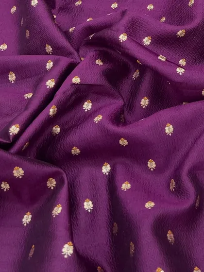 This deep purple Banarasi silk brocade is pure opulence. The small, woven butis create a rich texture that is perfect for a blouse, men's jacket, or a full lehenga.