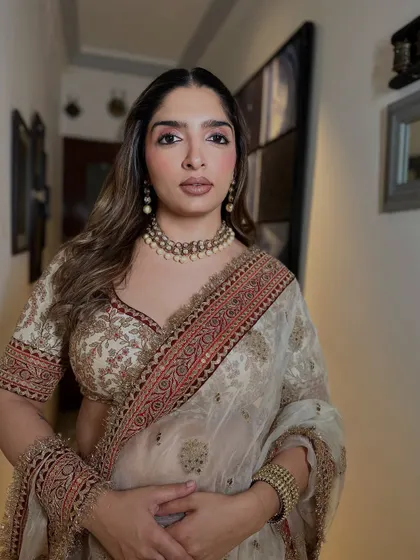A confident portrait of the guest, ready for the celebration. The makeup is elegant and understated, proving that soft glam can make a powerful statement.