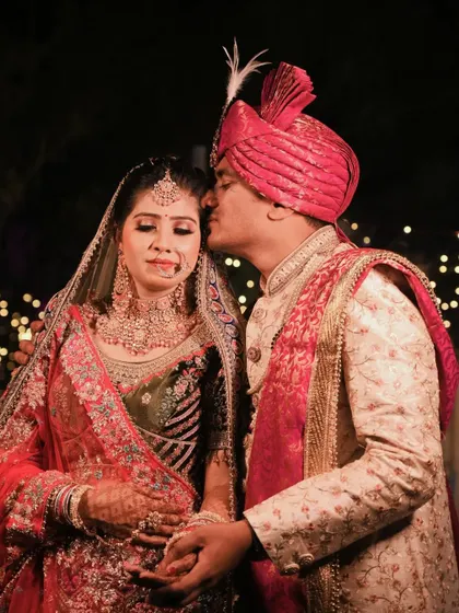 A gentle kiss on the forehead, a simple yet powerful gesture of love and protection that we love to capture.