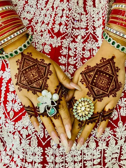 A close-up of the modern geometric bridal design. The pattern is bold and symmetrical, creating a powerful statement that complements the bridal attire.
