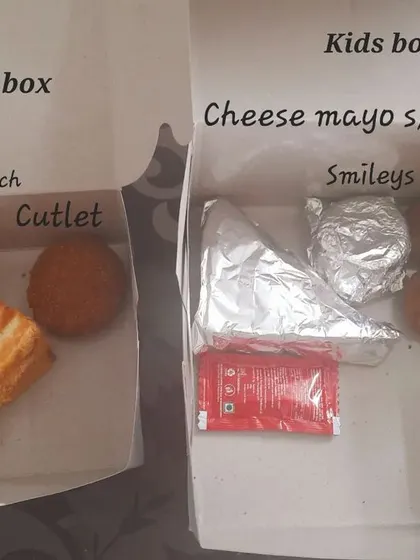 Customization is key for our party boxes. For this event, the parents' box had a grilled sandwich and cutlet, while the kids' box was filled with a cheese mayo sandwich, mini cutlets, and smileys.