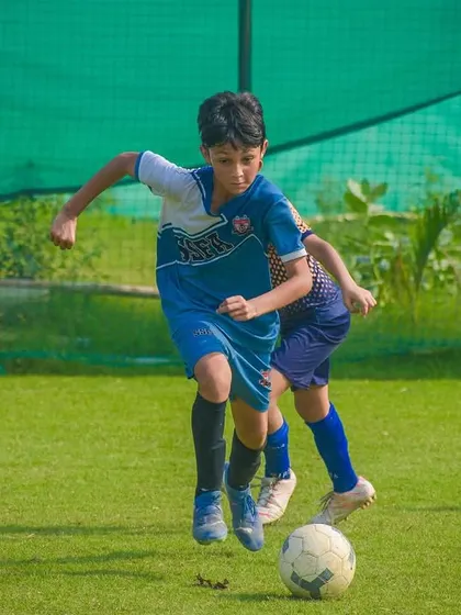 A player dribbles with speed and control, looking to create a scoring opportunity for their team.