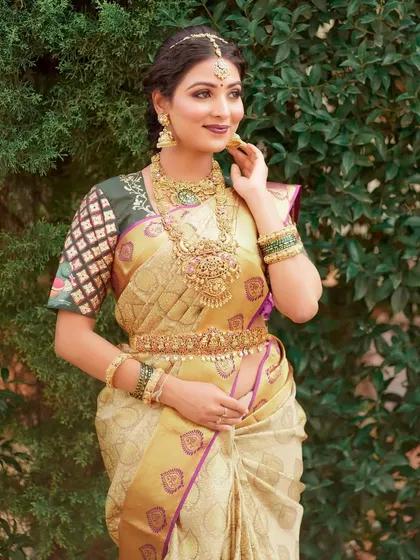 A classic three-quarter pose. The makeup is perfectly balanced, with strong features that don't overwhelm the bride's natural beauty.