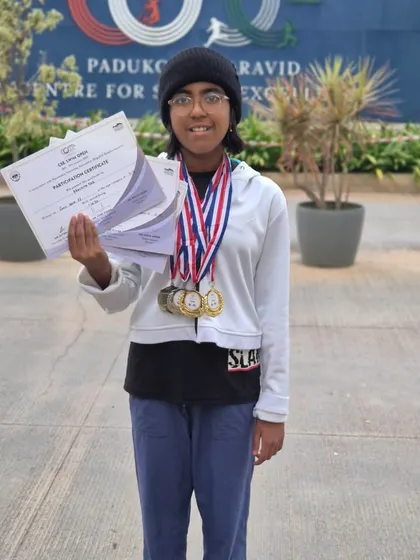 Prachita Deb with her certificates and medals from the CSE Swimming Competition, where she won two golds and two silvers in freestyle and butterfly events.