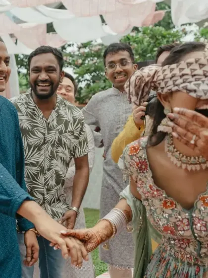 Games are a wonderful way to bring everyone together. During Hema and Karthik's Mehendi in Chennai, we organized a fun blindfold game for the couple, creating moments of laughter and adorable interaction.