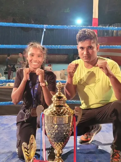 Our champion Pooja Varma with her coach and the trophy from the Krida Mahotsav tournament. We celebrate every victory, big or small.