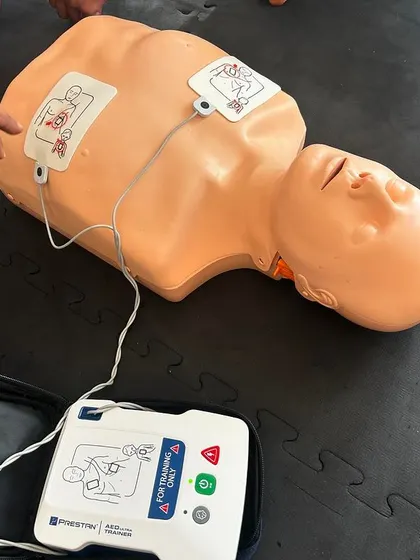 A close-up of the AED (Automated External Defibrillator) machine used during our CPR and first aid training.