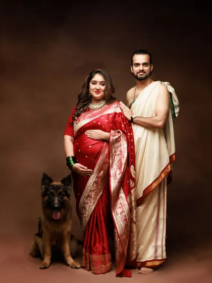 Celebrating family in all its forms. This traditional maternity portrait beautifully includes the family's beloved German Shepherd, because pets are family too.