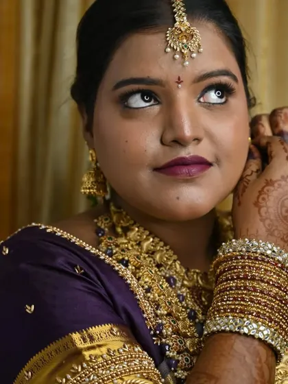 A candid moment of the bride getting ready. This shot captures the anticipation and excitement of the wedding day.