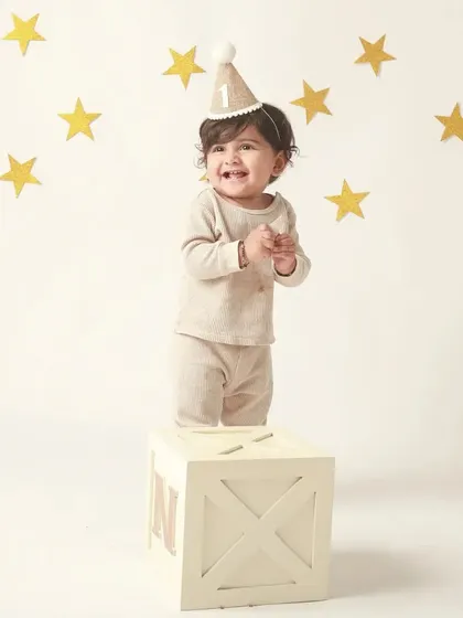 A clap and a smile! This is the pure, unfiltered joy of being one year old.