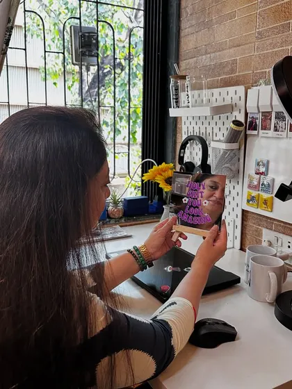 Here I am at my new workstation, admiring one of my affirmation mirrors. It's important to have positive reminders around you while you work.