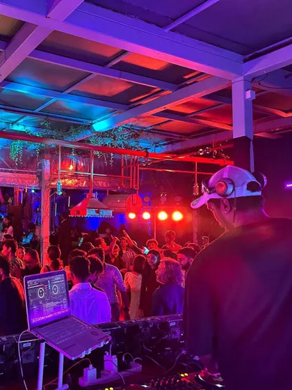 The red and blue lights created a cool contrast over the dancing crowd.