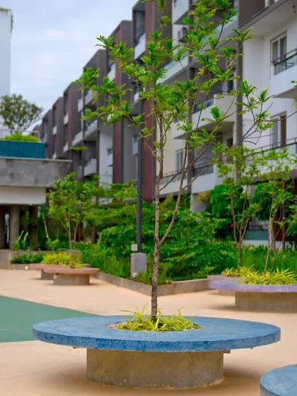 A detail of the custom-designed circular seating at POETREE, which doubles as a planter. These elements serve a functional purpose while adding a colorful, sculptural quality to the landscape.