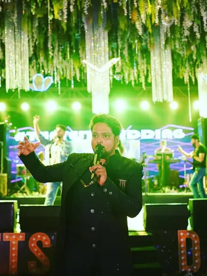 Commanding the stage at a destination wedding. My focus is on creating a dynamic and entertaining experience for everyone present.