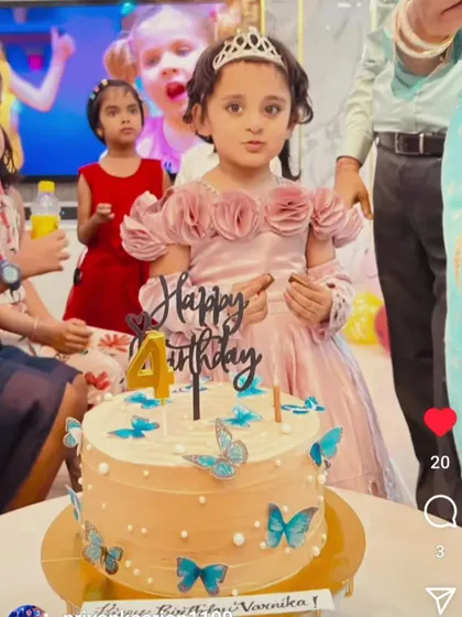 The birthday girl enjoying her whimsical butterfly-themed cake. These happy moments are everything!