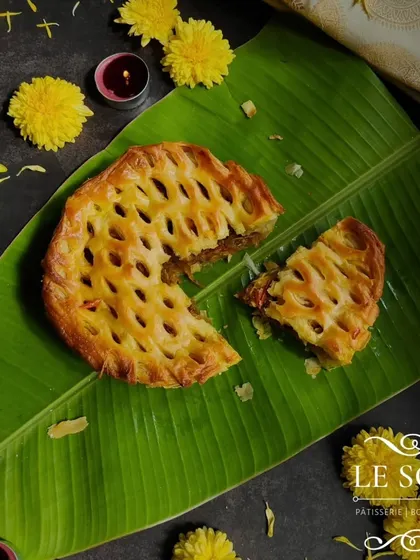 A slice of the Egg Roast Puff Pie, revealing the generous and flavourful filling inside. This is the only egg-based item from my special Onam menu.