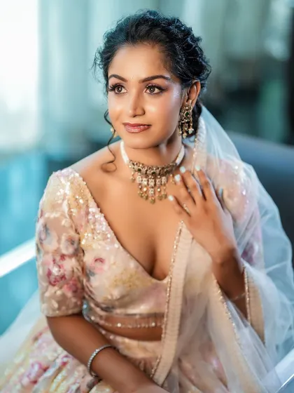 A candid-style portrait where the model looks away, creating a natural and thoughtful mood. The focus is on the neckline and choker.