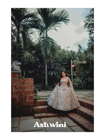 A beautiful portrait of Ashwini descending the stone steps at her reception venue.