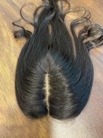 The secret to an undetectable hair topper is the scalp. This is a close-up of my silk base topper, showing the realistic, hand-tied parting that looks just like your own.