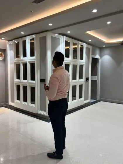 A final look at the completed mirrored wall paneling, which serves as a stunning backdrop for the living room.