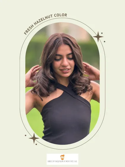 A closer look at the soft curls and chocolatey tones of this hazelnut color. It’s a luxe, trendy look that enhances the client's natural beauty.