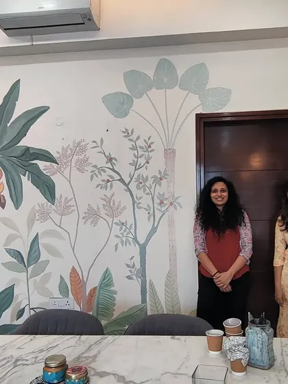Posing with the hosts in front of their newly painted pastel tropical mural. It's always a pleasure to create art for such warm and welcoming clients.