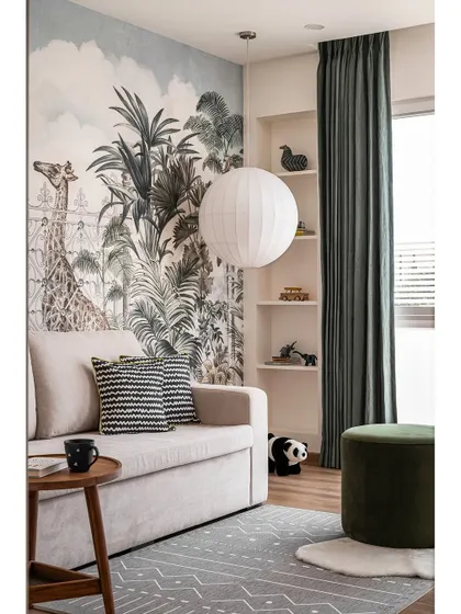 The kids' room was designed to be a fun and imaginative space. A jungle-themed mural from Rebel Walls creates a stunning feature wall, paired with pastel tones and crisp white.