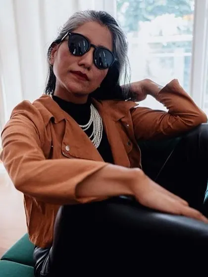 This angle shows how the layers and accessories come together to create a cohesive, edgy look.