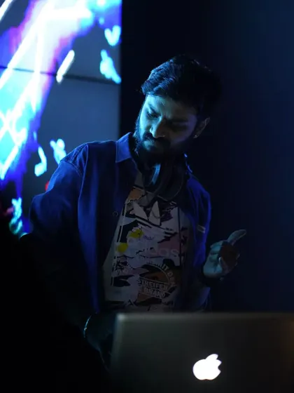 My motto is "Mind & Grind." This shot captures my focus during a set. I'm constantly reading the room and adjusting the music, ensuring the energy never dips on the dance floor.