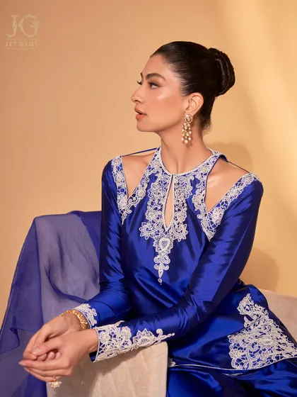 A moment of quiet elegance. Our Polki and pearl drop earrings add a touch of heritage and sophistication to this beautifully embroidered attire.