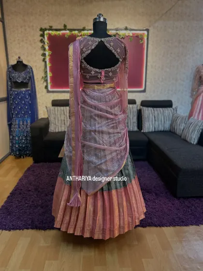 A unique langa davani with a multi-colored pleated skirt and a pre-draped dupatta.