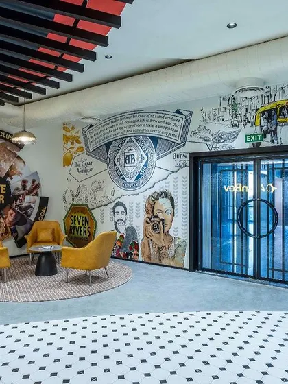 The reception area is the first impression of your company. For the AbInbev corporate office, we designed a 60-foot mural that brings together 35 artists to tell the story of the company's brands and their presence in India.