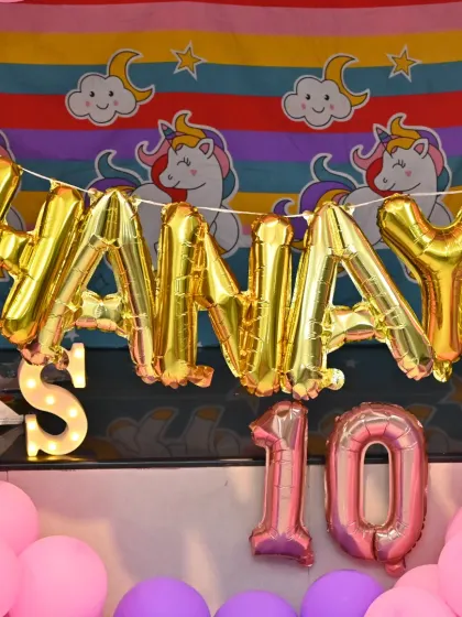 A close-up of the personalized Unicorn theme backdrop for Shanaya's 10th birthday.