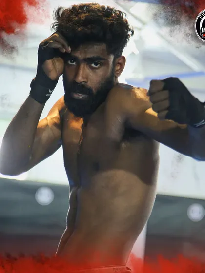A portrait of one of our dedicated fighters. The intensity in his eyes shows the focus and determination we cultivate in all our athletes.