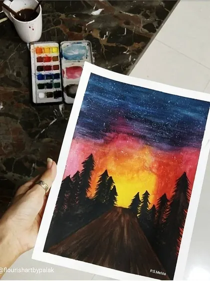 Another view of the starry night watercolor, showing the texture of the paper and the vibrant pigments of the paint palette I used.
