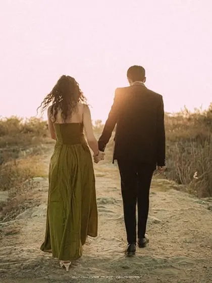Walking hand-in-hand towards the sunset, this image is the epitome of romance. It captures the promise of a beautiful future together.