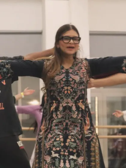 Students enjoying a fun, interactive moment during a Bollywood workshop. It's all about creating happy memories.