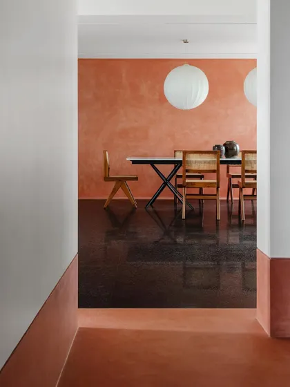 This dining space shows a table I designed with a slim profile and strong geometric base. It is paired with classic caned chairs, creating a look that is both modern and timeless.