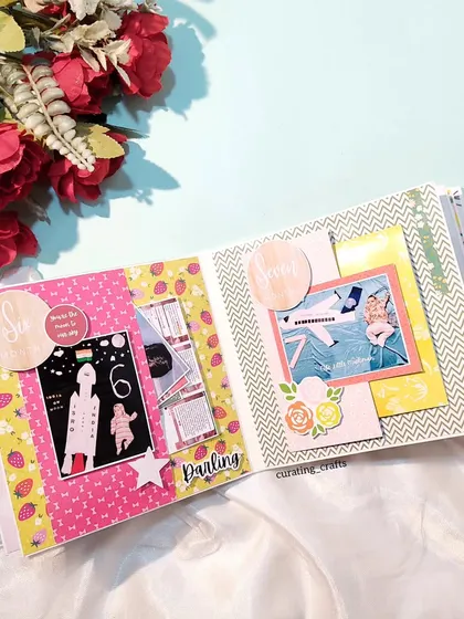 An inside page of the baby record book, documenting the 6-month milestone with photos and messages.