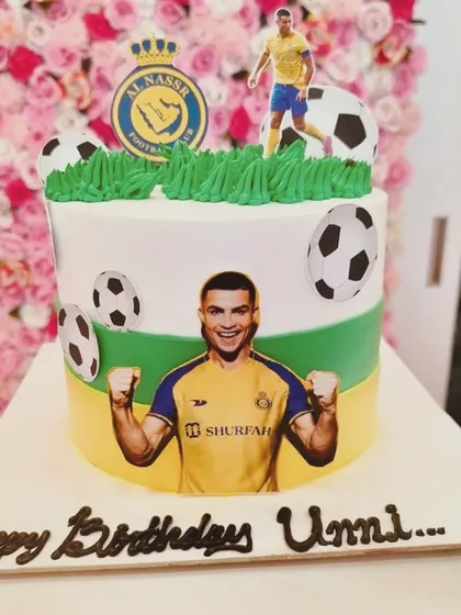 A cake for a Cristiano Ronaldo fan, featuring his picture and the Al Nassr FC logo. Photo cakes are a great way to personalize for any fan.