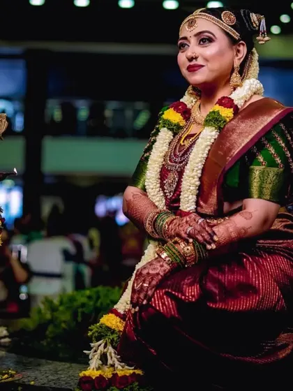 Candid moments from an Iyengar wedding. The bride's makeup is traditional and flawless, designed to last through all the smiles and rituals of the day.