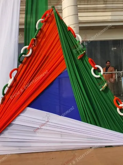 A unique triangular structure made from tricolor fabrics, creating a modern and abstract representation of the Indian flag. This type of installation is great for outdoor spaces and commercial complexes.