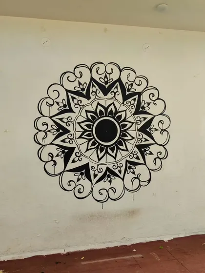 The completed black and white mandala, before the final color accents were added. Even in monochrome, the detailed patterns create a powerful visual impact, bringing a sense of focus and artistry to the space.