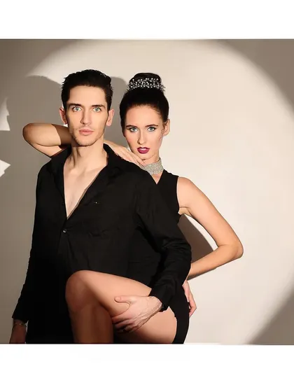 A dynamic and intimate pose from the same couple's shoot. This image showcases chemistry and confidence, creating a compelling fashion narrative.