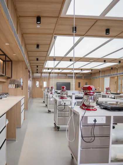 A view down the line of workstations, each ready for action.