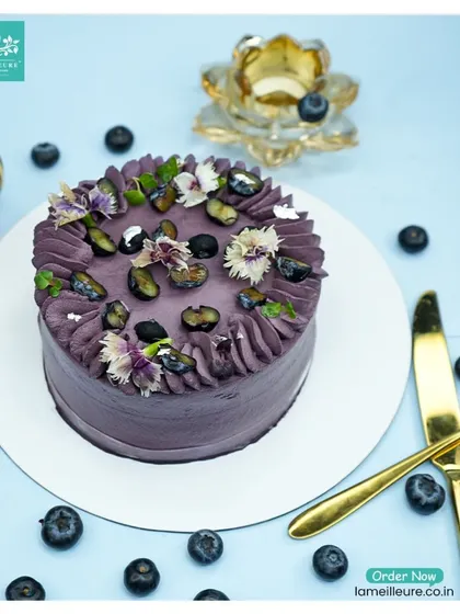 This beautiful Blueberry cake is covered in a lovely lavender-hued cream. It's generously topped with fresh blueberries and delicate edible flowers for a fresh, fruity dessert.