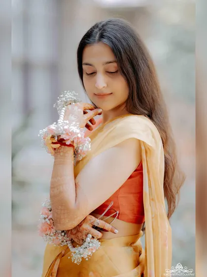 A personal photo from my wedding festivities, feeling content and happy. These personal moments of joy inspire the music I create.