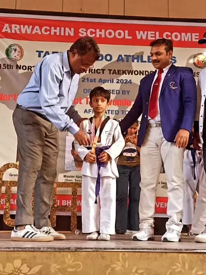 One of my young students receiving his gold medal at the district championship.