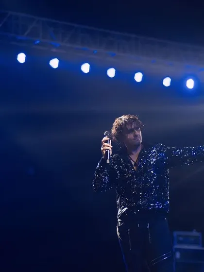The artist and his stage. This shot of Sonu Nigam under a wide array of blue lights shows the scale of the production and his command over the entire stage.